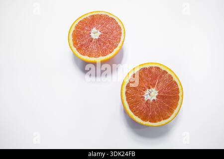 Fresh Blood Orange and Halved Red Oranges Isolated on White Background, Studio Food Photography Stock Photo