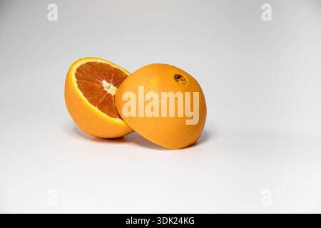 Fresh Blood Orange and Halved Red Oranges Isolated on White Background, Studio Food Photography Stock Photo