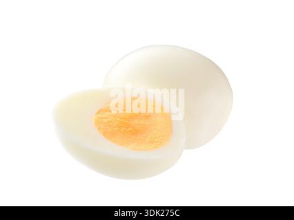 hard boiled chicken eggs isolated on white. Single whole boiled egg with halved egg isolated on a white background. Stock Photo