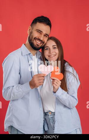 Celebrating Valentine's day. Lovely couple are together in the studio. Stock Photo