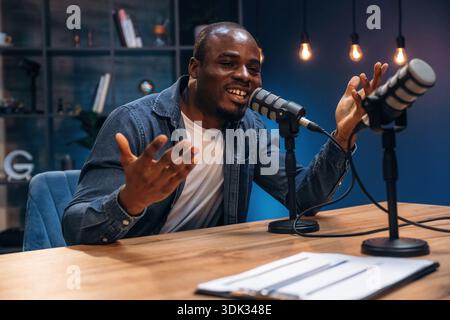 Black man is doing podcast in the studio. Stock Photo