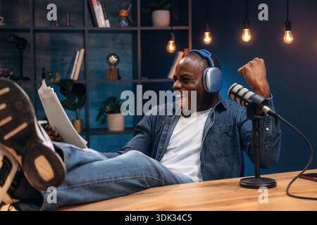 Black man is doing podcast in the studio. Stock Photo