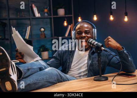 Black man is doing podcast in the studio. Stock Photo
