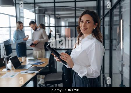 Positive facial expression. Business people are working in the office. Stock Photo