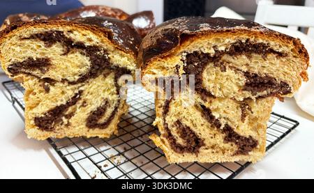 Cozonac, freshly baked Romanian homemade traditional Easter and Christmas sweet bread dessert. Holiday season. Eastern European baked dessert. Stock Photo