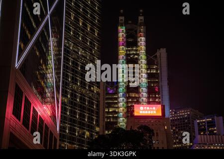 The bustling central city in Hong Kong, the HSBC main building and others are illuminated at night. Stock Photo