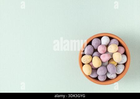 Speckled assorted mini chocolate eggs in bowl Stock Photo