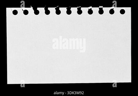 Torn Spiral Notebook Page isolated on black Background Stock Photo