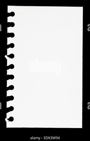 Torn Spiral Notebook Page isolated on black Background Stock Photo