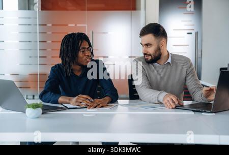 Modern office. Two men are working. Stock Photo