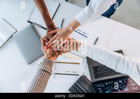Teamwork, hands on hands, successful. Top view of hands of business people. Stock Photo