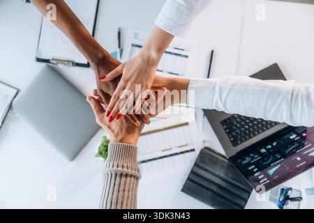 Teamwork, hands on hands, successful. Top view of hands of business people. Stock Photo