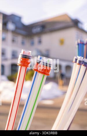 Colourful cables with coloured connectors in front of a blurred building, fibre-optic groundbreaking, Freudenstadt, Germany Stock Photo
