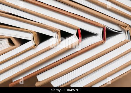Many different half open books as background, top view Stock Photo