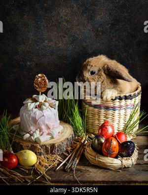 Festive Easter display. Spring holiday arrangement with bunny and treats Stock Photo