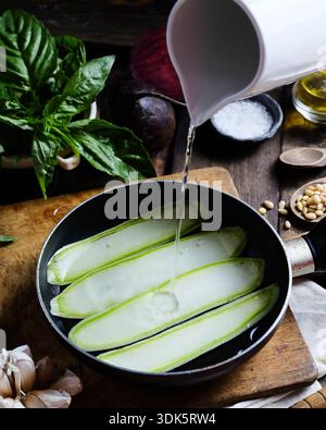 Summer vegetable thin slices cooked gently in creamy sauce with basil Stock Photo