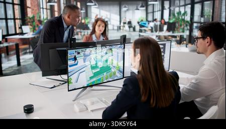 Engineers On GIS Team Using Design Software For Mapping Land. Stock Photo