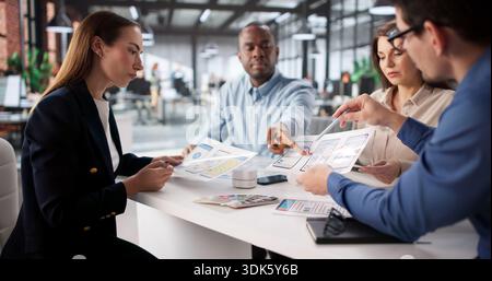 Innovative African American Designer Working With Diverse Business Team In Meeting. Stock Photo