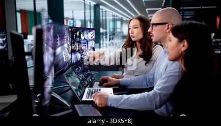Monitoring Room Where Security Camera System And CCTV Surveillance Is Observed. Stock Photo