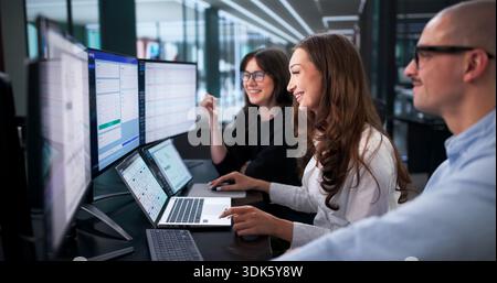 Corporate Accountant Automating Tax Reporting & Billing In Office Setting Stock Photo