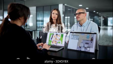Real Estate Design Team Using CAD Software For House Project Stock Photo