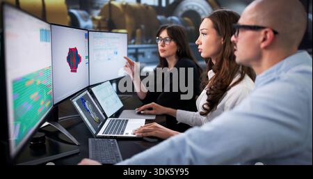 Industrial Engineers Using 3D Software To Do Gas Turbine Maintenance. Stock Photo