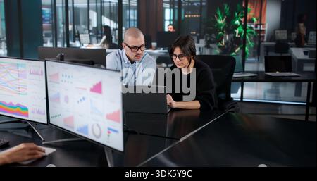 Business Analyst Team Is Analyzing High Performance Data On Multiple Computers Stock Photo