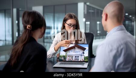 First-Time Homebuyers Meet With Real Estate Agent To Discuss Options. Stock Photo
