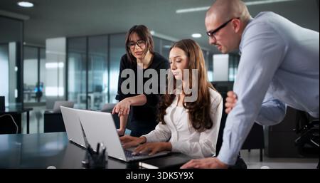 Intense Coding Session: Diverse Team Of Programmers Develop Software Programs. Cipher Fraud: Accountant Stock Photo