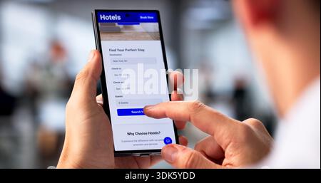 Young Hispanic Man Browsing Smartphone For Hotel Deals Online. Marketing Specialist. Stock Photo