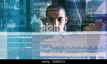 Hologram, data and man with coding in office with software script, system update and debugging. Night, programmer or UI dashboard with overlay for Stock Photo