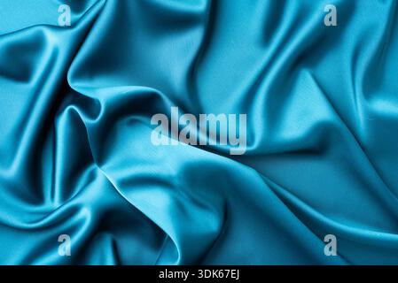 Turquoise satin texture with elegant waves Stock Photo