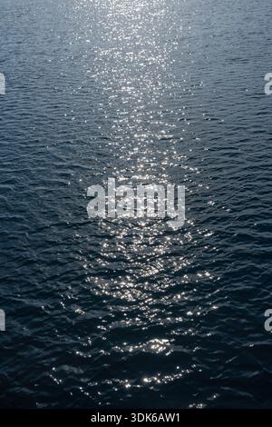 Sparkling blue sea surface. Abstract background. Stock Photo