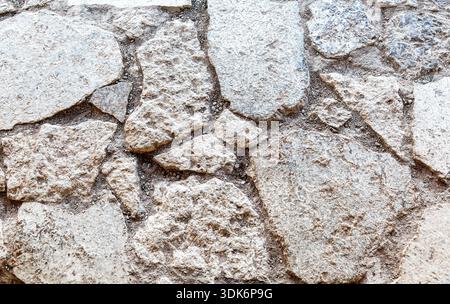 Rough gray stone wall as creative background. Grunge brick wall texture background Stock Photo