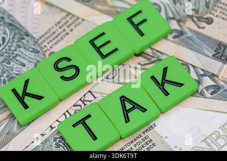 Blocks with the abbreviation TAK KSEF, standing for positives about National E-invoice System, are placed against a background of loosely spread Polis Stock Photo