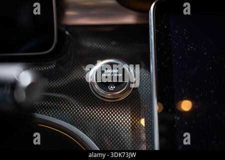 Zurich Auto Show, Switzerland, October 31, 2025. Engine start stop button on the central console of a new Mercedes Benz car displayed at the Auto Zuri Stock Photo