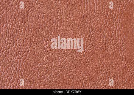 Full Frame Texture of Brown Faux Leather Material: Close-up of a Grained Synthetic Surface with Natural Leather Pattern and Warm Earthy Tones Stock Photo