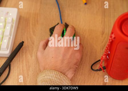 Person working on 3D animation at desk with graphics tablet and mechanical keyboard Stock Photo