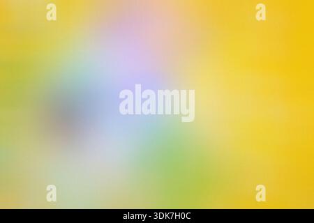 Soft abstract yellow green gradient background with blurred multicolor center and subtle grain texture. Copy space Stock Photo