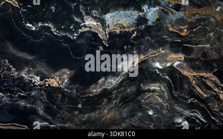 Dark brown marble texture with white natural veins. Polished stone surface showing organic patterns and elegant contrast, perfect for backgrounds Stock Photo