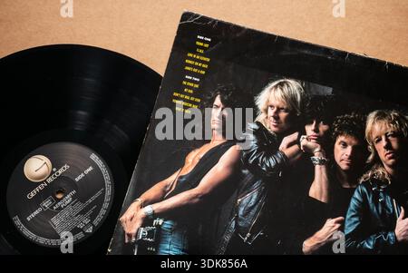 'Aerosmith' - 'Pump' vinyl record with album cover featuring band members and tracklist, isolated on light plain background, top angle shot Stock Photo