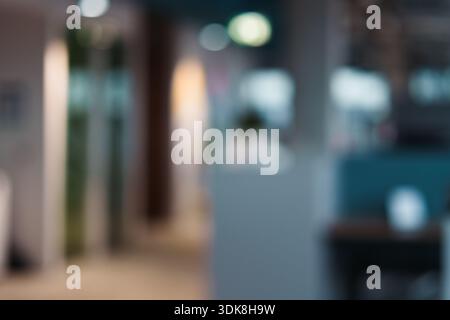 Office interior bokeh blur background. Modern workplace atmosphere abstract defocused scene suitable presentation slides corporate branding technology Stock Photo