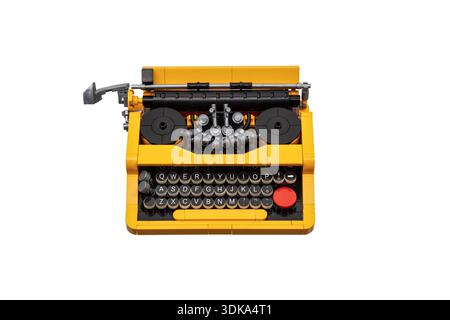Yellow and black toy construction block typewriter model isolated on white background. Stock Photo