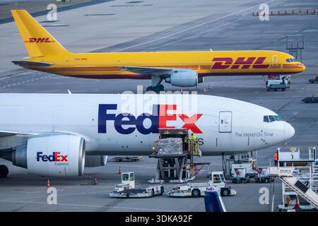 FedEx Express Boeing 777-FS2 cargo plane is unloaded, air freight
