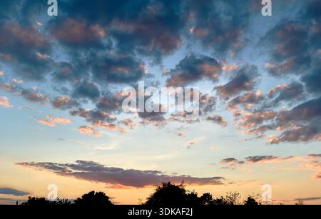 Dramatic Cloudy Sky at Sunset Stock Photo