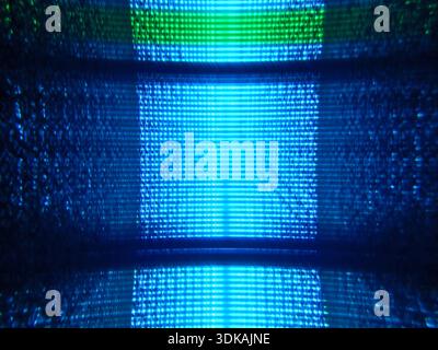 Abstract background texture of glowing blue digital lines and pixels creating a futuristic high-tech data matrix atmosphere in the dark. Stock Photo