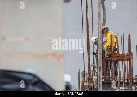 Bucharest, Romania - January 30, 2026: Romanian construction workers on a construction site. Stock Photo