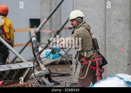 Bucharest, Romania - January 30, 2026: Romanian construction workers on a construction site. Stock Photo