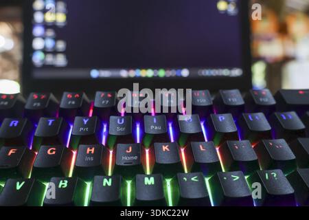 Close up view of colorful RGB gaming keyboard. This modern, illuminated device has backlit design, creating an immersive mood for intense technology f Stock Photo