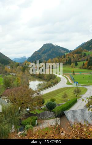 Empty Asphalt Road Winding Through Colorful Fall Nature Scene. Stock Photo